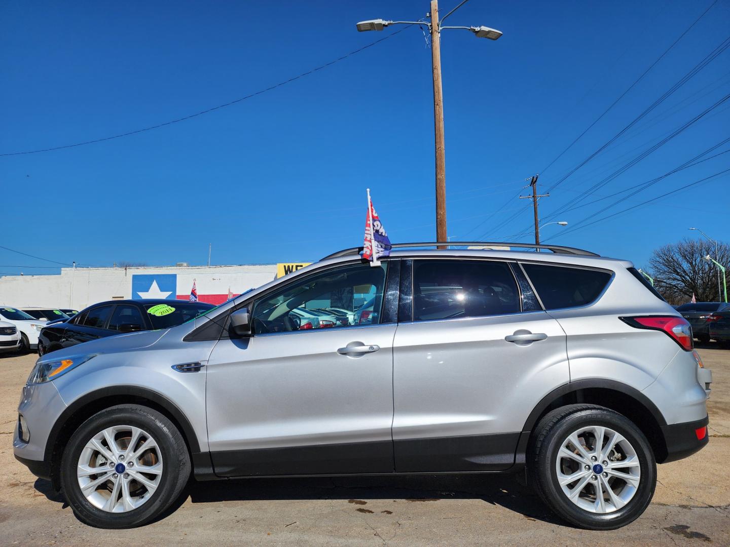 2017 SILVER Ford Escape SE (1FMCU0GD3HU) with an 1.5L L4 DOHC 16V engine, 6A transmission, located at 2660 S.Garland Avenue, Garland, TX, 75041, (469) 298-3118, 32.885551, -96.655602 - Welcome to DallasAutos4Less, one of the Premier BUY HERE PAY HERE Dealers in the North Dallas Area. We specialize in financing to people with NO CREDIT or BAD CREDIT. We need proof of income, proof of residence, and a ID. Come buy your new car from us today!! This is a Super Clean 2017 FORD ESCAP - Photo#6